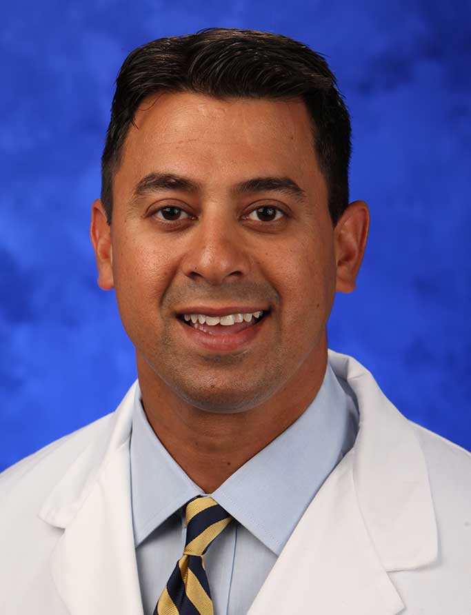 A head-and-shoulders photo of Aman Dhawan, MD